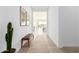 Spacious hallway with a neutral color palette and natural light at 2553 E Virginia Cir, Mesa, AZ 85213