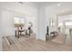 Functional home office with a rustic wooden desk and patterned rug at 2553 E Virginia Cir, Mesa, AZ 85213