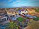 Aerial view of two story house with solar panels, large backyard, and community pool at 29405 W Columbus Ave, Buckeye, AZ 85396