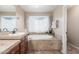 Bathroom features a large garden tub and double sinks at 29405 W Columbus Ave, Buckeye, AZ 85396