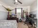 Bedroom with workspace and ceiling fan at 29405 W Columbus Ave, Buckeye, AZ 85396