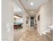 Tile entryway with staircase and view into game room with pool table at 29405 W Columbus Ave, Buckeye, AZ 85396