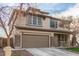 Two-story house with brown garage door and nicely landscaped yard at 29405 W Columbus Ave, Buckeye, AZ 85396