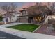 Two-story house with brown garage door and a landscaped front yard at 29405 W Columbus Ave, Buckeye, AZ 85396