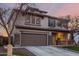 Two-story house with brown garage door and well-manicured lawn at 29405 W Columbus Ave, Buckeye, AZ 85396