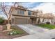 Two-story house with brown garage door and a well-maintained lawn at 29405 W Columbus Ave, Buckeye, AZ 85396