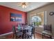 Dining area with glass-top table, Southwestern-style chairs, and a desert landscape painting at 3270 S Goldfield Rd # 816, Apache Junction, AZ 85119