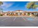 Low angle of a commercial building with multiple entrances, landscaped grounds and ample parking at 3270 S Goldfield Rd # 816, Apache Junction, AZ 85119