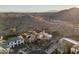 Aerial view of a home with desert landscaping, a pool, and mountain views at 3439 E Tonto Dr, Phoenix, AZ 85044