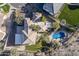 Aerial view of home showcasing tile roof, private pool, and desert landscaping at 3439 E Tonto Dr, Phoenix, AZ 85044