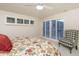 Bedroom with shuttered windows offering light control and privacy at 3439 E Tonto Dr, Phoenix, AZ 85044