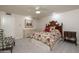 A cozy bedroom showcases a decorative bed frame, patterned bedding, and neutral walls at 3439 E Tonto Dr, Phoenix, AZ 85044