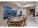 A dining area features desert landscaping and a view of the backyard visible through the window at 3439 E Tonto Dr, Phoenix, AZ 85044