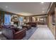 Spacious living room features a fireplace, recessed lighting, comfortable seating, and built-in shelving at 3439 E Tonto Dr, Phoenix, AZ 85044