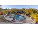 Backyard features a beautiful in-ground pool with desert landscaping and mountain views at 3439 E Tonto Dr, Phoenix, AZ 85044