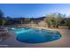 Charming pool with spa featuring elegant lighting and meticulously designed landscaping at 3439 E Tonto Dr, Phoenix, AZ 85044