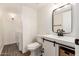 Modern bathroom with white vanity and black accents at 3511 E Baseline Rd # 1206, Phoenix, AZ 85042