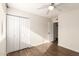 Bright bedroom with double door closet and wood-look floors at 3511 E Baseline Rd # 1206, Phoenix, AZ 85042