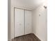 White double door closet with wood-look floors at 3511 E Baseline Rd # 1206, Phoenix, AZ 85042