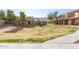 View of community with grassy area and walkways at 3511 E Baseline Rd # 1206, Phoenix, AZ 85042