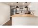 Modern kitchen with butcher block countertops, stainless steel appliances, and white shaker cabinets at 3511 E Baseline Rd # 1206, Phoenix, AZ 85042