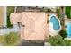 An aerial view featuring a terra cotta tile roof, a private pool, a landscaped backyard, and a well-maintained yard at 3843 E Old Stone N Cir, Chandler, AZ 85249