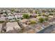 A residential community featuring well-maintained homes with mature trees, terracotta tile roofs, and lush landscaping in a neighborhood at 3843 E Old Stone N Cir, Chandler, AZ 85249