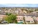 A residential neighborhood with a lush, green landscape and terracotta roofs in a community with mature trees and pools at 3843 E Old Stone N Cir, Chandler, AZ 85249