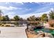 Scenic view of a community lake with a bridge, lush landscaping, and clear blue skies on a sunny day at 3843 E Old Stone N Cir, Chandler, AZ 85249