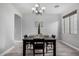 Elegant dining room with a dark wood table, seating for four, and stylish decor, perfect for gatherings at 3843 E Old Stone N Cir, Chandler, AZ 85249