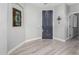 Welcoming entryway featuring light wood floors, neutral paint, and an inviting front door at 3843 E Old Stone N Cir, Chandler, AZ 85249