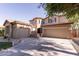 Elegant two-story home with a three-car garage and spacious driveway at 3843 E Old Stone N Cir, Chandler, AZ 85249