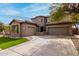 Charming two-story home with a three-car garage and spacious driveway at 3843 E Old Stone N Cir, Chandler, AZ 85249