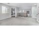 Neutral hallway features carpet and an open doorway with natural light from the window at 3843 E Old Stone N Cir, Chandler, AZ 85249