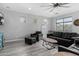 Spacious living room with a ceiling fan, recessed lighting, and comfortable seating, ideal for relaxation and entertainment at 3843 E Old Stone N Cir, Chandler, AZ 85249