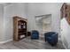 Cozy living room with wood-look floors, stylish decor, and ample natural light streaming through the window at 3843 E Old Stone N Cir, Chandler, AZ 85249