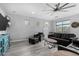 Comfortable living room with a large ceiling fan, recessed lighting and a modern sleek design at 3843 E Old Stone N Cir, Chandler, AZ 85249