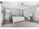 Cozy main bedroom offers a ceiling fan, neutral walls, and natural light at 3843 E Old Stone N Cir, Chandler, AZ 85249