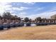 Community pond with decorative fountain, rock features, and pergola walkway at 3843 E Old Stone N Cir, Chandler, AZ 85249