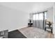 Bedroom with wood floors, gray curtains, and end tables at 3925 W San Juan Ave, Phoenix, AZ 85019