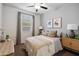 Cozy bedroom with neutral tones and a ceiling fan at 39995 W Agave Rd, Maricopa, AZ 85138