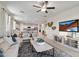 Bright and airy living room with views into the kitchen at 39995 W Agave Rd, Maricopa, AZ 85138