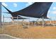 Playground with shade sails and various play structures at 39995 W Agave Rd, Maricopa, AZ 85138