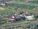 Aerial view of a community center with a pool, park, baseball fields and other recreational activities at 42225 N Celebration Way, Phoenix, AZ 85086