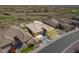 Beautiful aerial view of a desert home with a tile roof, pool and spa in a golf course community at 42225 N Celebration Way, Phoenix, AZ 85086