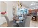 This stylish dining area is conveniently located next to the home's modern kitchen at 42225 N Celebration Way, Phoenix, AZ 85086