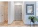 Inviting entryway with tile floors, neutral walls, and decorative mirror at 42225 N Celebration Way, Phoenix, AZ 85086