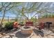 Outdoor firepit area surrounded by comfortable seating, perfect for entertaining and relaxation at 42225 N Celebration Way, Phoenix, AZ 85086