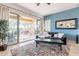 Comfortable living room with tile floors, a sliding door to the backyard, and an inviting area rug at 42225 N Celebration Way, Phoenix, AZ 85086