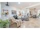 Open-concept living room with guitars on the wall, and access to dining area at 42225 N Celebration Way, Phoenix, AZ 85086